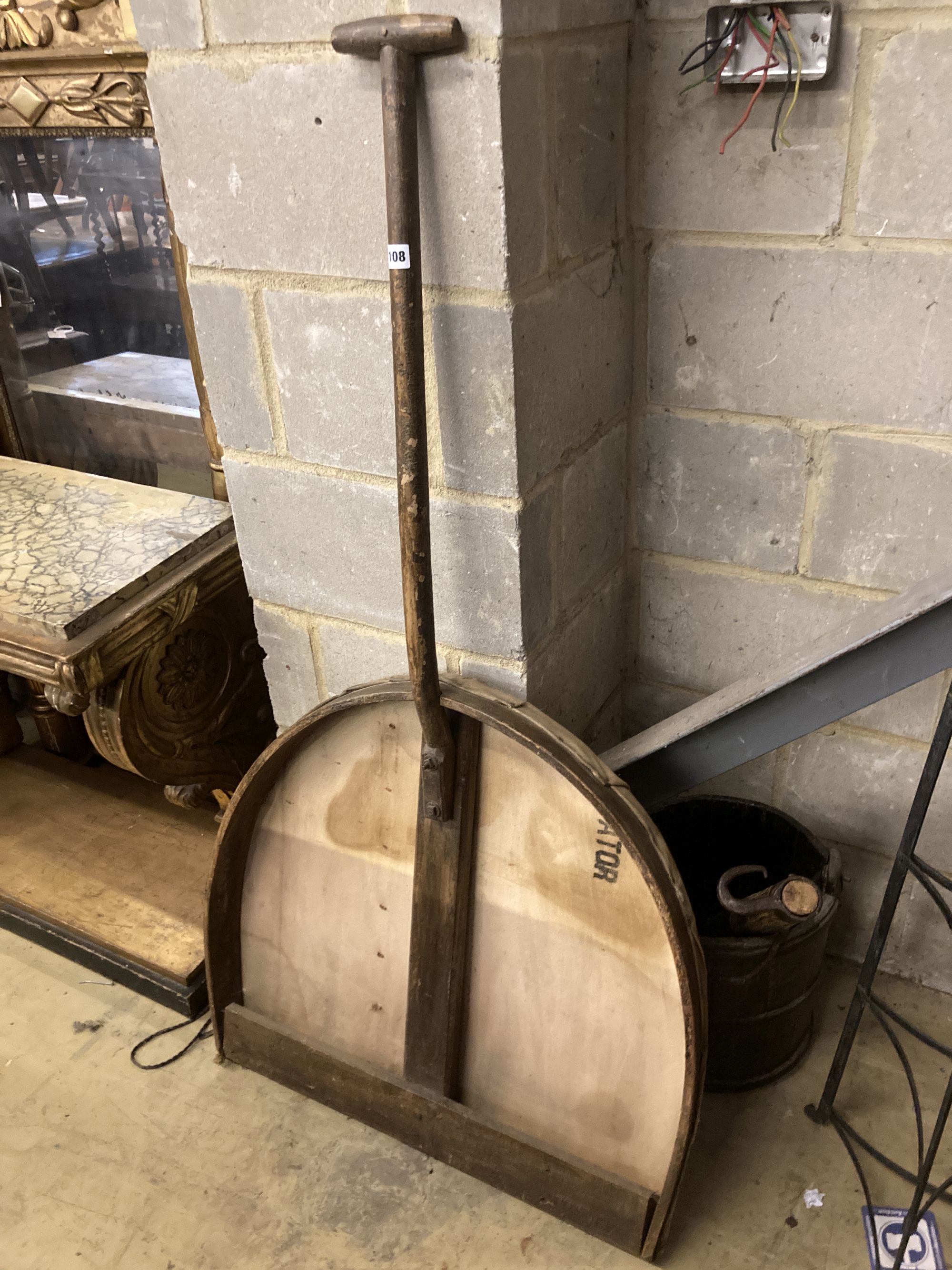 A Victorian mulch shovel, wrought iron pot stand and a yoke